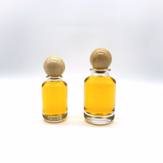 Venda imperdível Frasco de perfume de vidro cilíndrico de 50 ml 100 ml com tampa redonda de madeira
